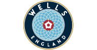A circular emblem with the words "Wells England" around a geometric blue pattern and a central red and white rose. - on localmedic