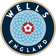 Circular emblem with "Wells England" text, featuring a pattern of interlocking circles in blue, centered around a red and white rose motif.